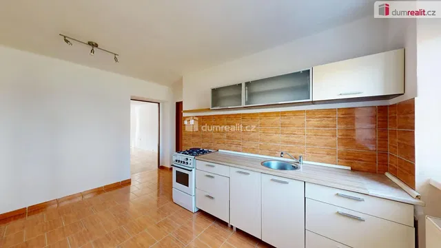 Kitchen; kitchen appliances, tile floor, natural light