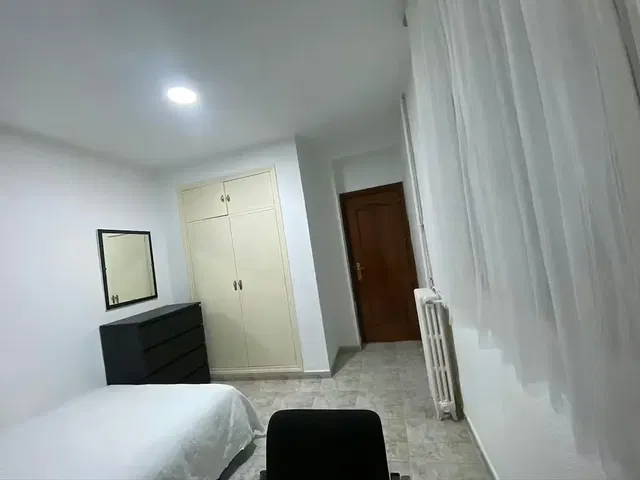 Bedroom; natural light, tile floor