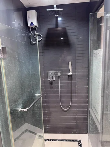 Bathroom; water heater, tile floor, natural light, renovated