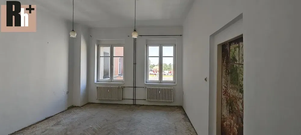 Living room; natural light, needs renovation, tile floor