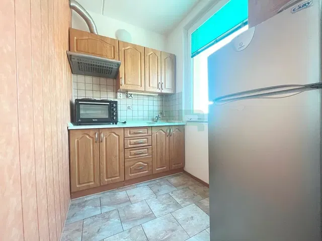 Kitchen; kitchen appliances, tile floor, natural light