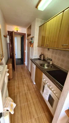 Kitchen; kitchen appliances, tile floor, natural light, modern style