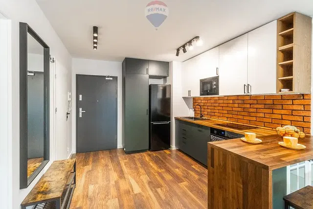 Kitchen; kitchen appliances, wood floor, natural light, modern style