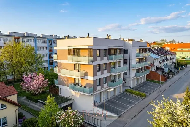 House and surroundings; view