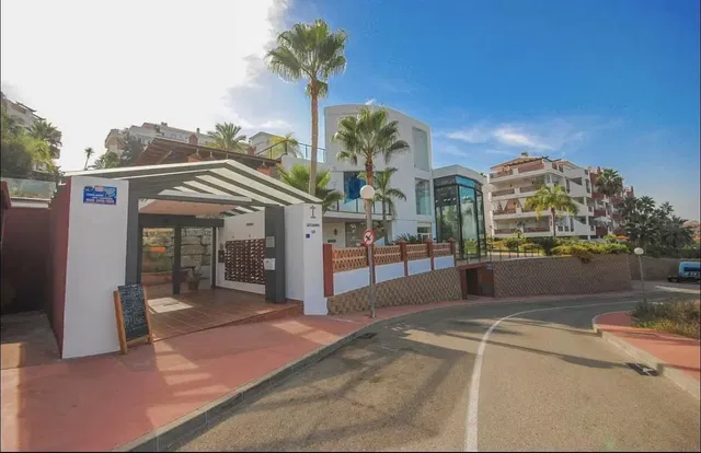 House and surroundings; view