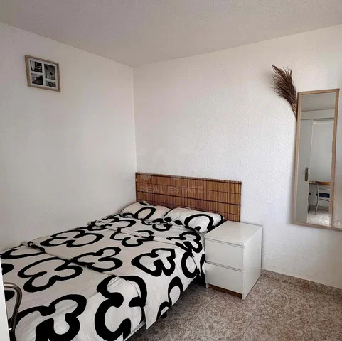 Bedroom; tile floor, natural light