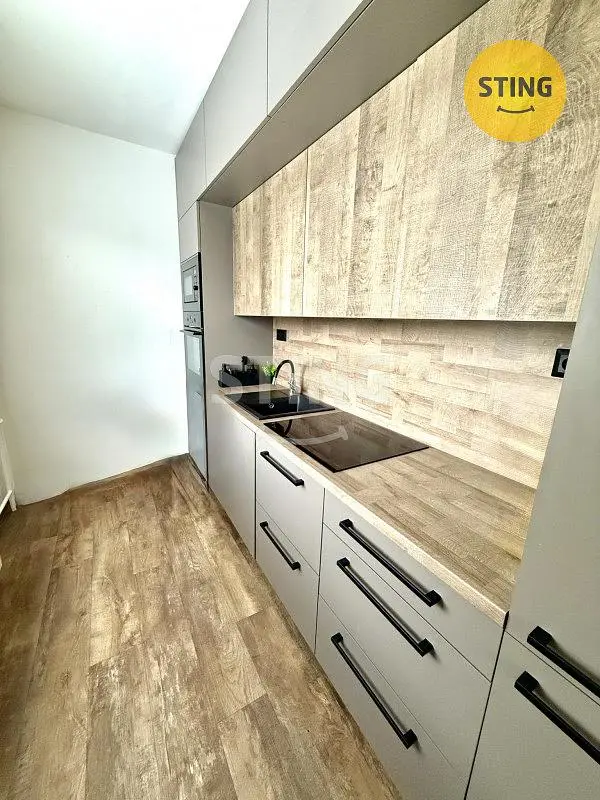 Kitchen; kitchen appliances, wood floor, renovated, natural light
