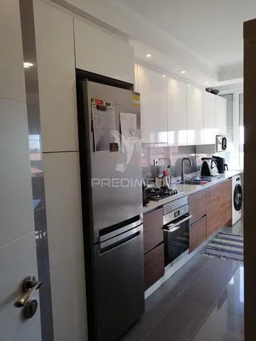 Kitchen; kitchen appliances, tile floor, natural light, modern style