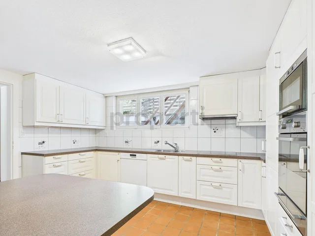 Kitchen; kitchen appliances, tile floor, natural light, renovated