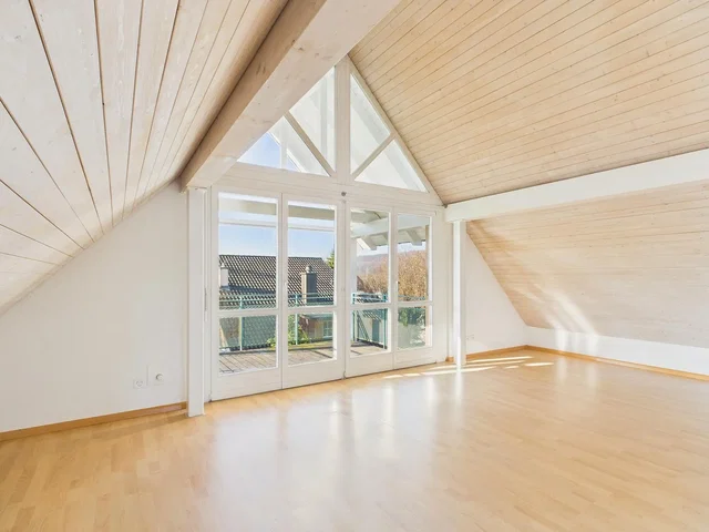 Kids room; natural light, wood floor, wood beams