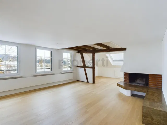 Living room; view, fireplace, wood beams, wood floor, natural light