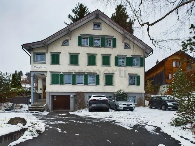 House and surroundings; view