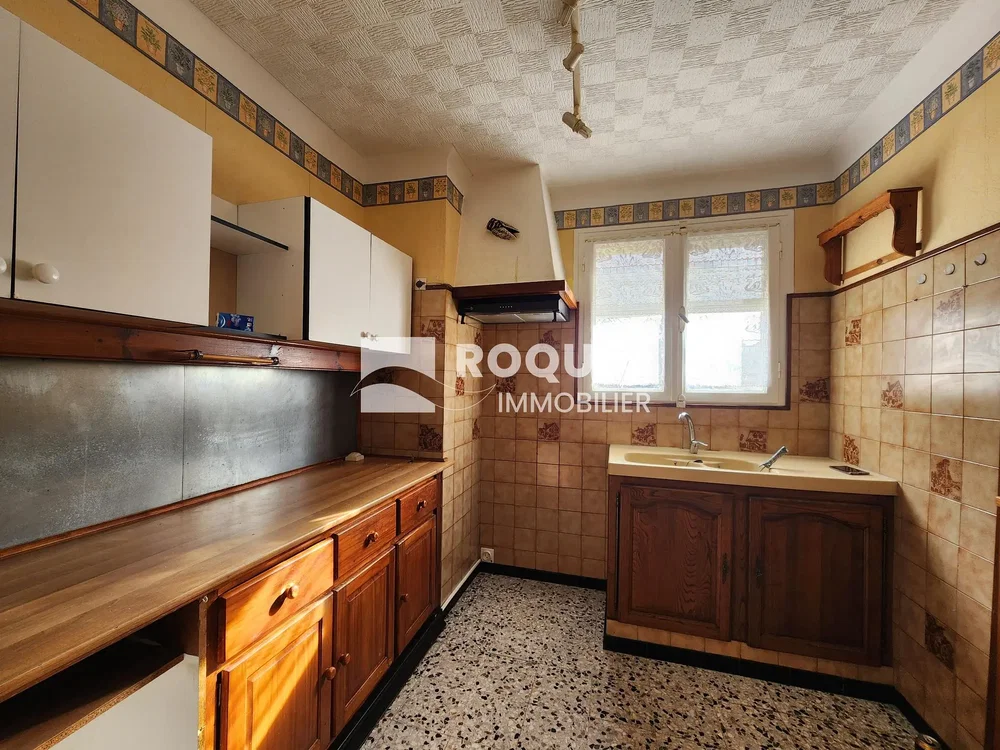 Kitchen; needs renovation, tile floor