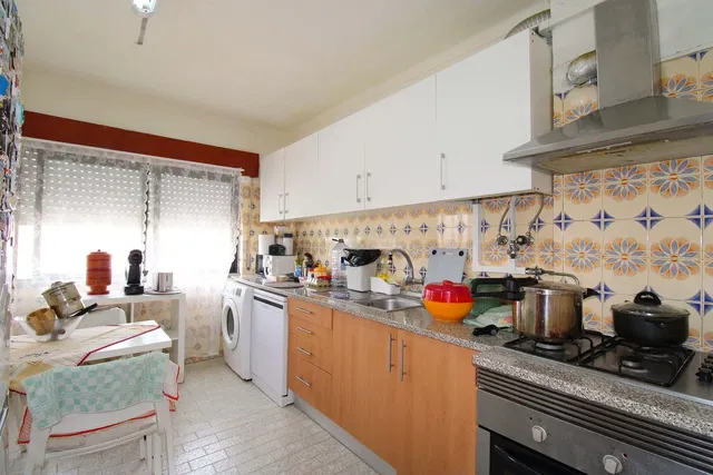 Kitchen; kitchen appliances, tile floor, natural light, rustic style