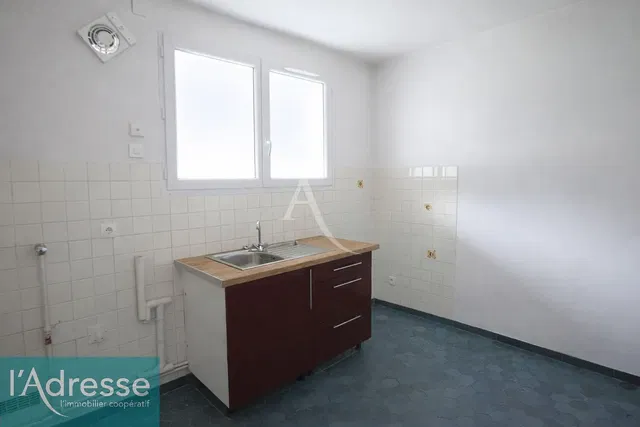 Kitchen; tile floor, needs renovation, natural light