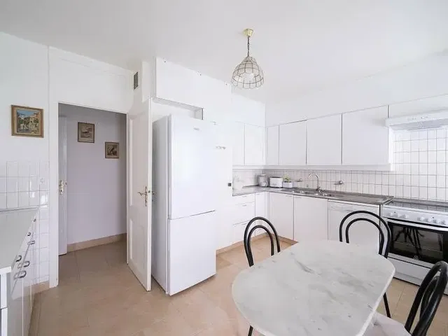 Kitchen; kitchen appliances, tile floor, natural light