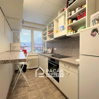 Kitchen; kitchen appliances, tile floor, natural light