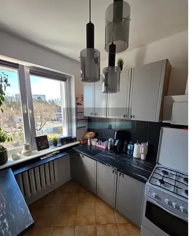 Kitchen; kitchen appliances, natural light, tile floor