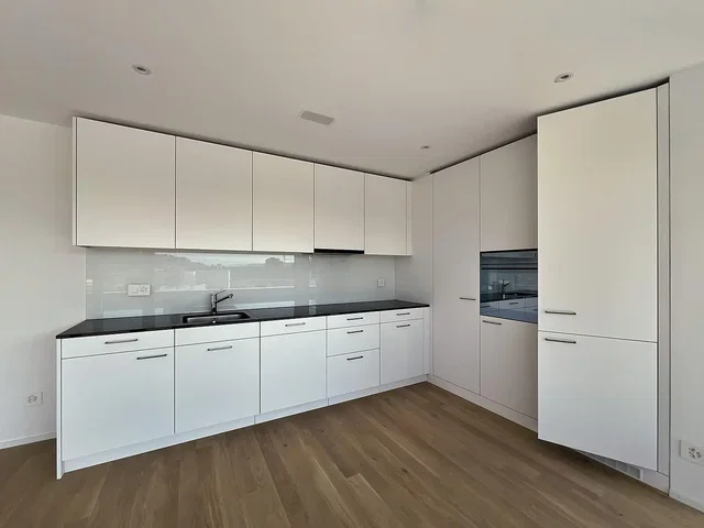 Kitchen; kitchen appliances, wood floor, renovated, natural light