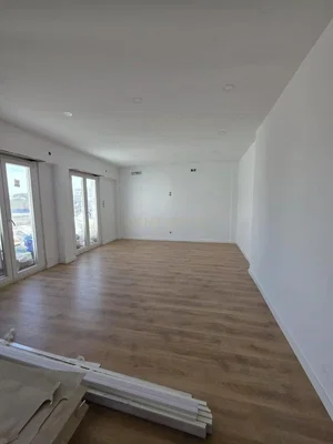 Living room; natural light, wood floor, renovated