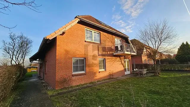 House and surroundings; view