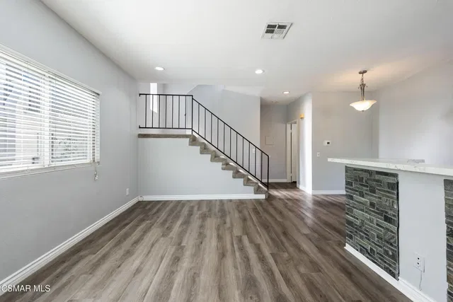 Living room; natural light, wood floor, renovated