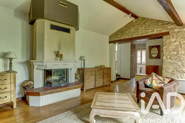Living room; fireplace, wood beams, wood floor, natural light, rustic style