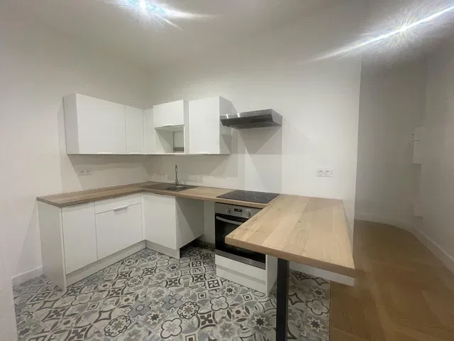 Kitchen; kitchen appliances, tile floor, renovated, natural light, modern style