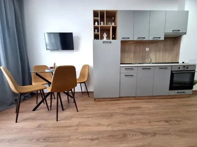 Kitchen; wood floor, modern style, kitchen appliances, natural light