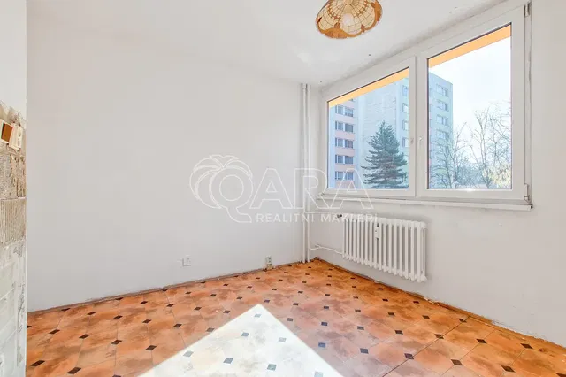 Living room; tile floor, view, needs renovation