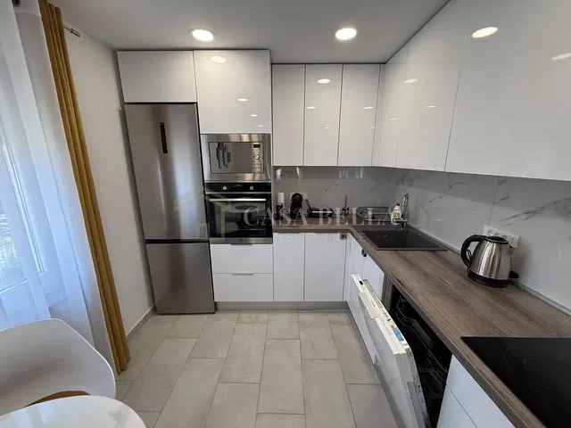 Kitchen; kitchen appliances, tile floor, renovated, natural light, modern style