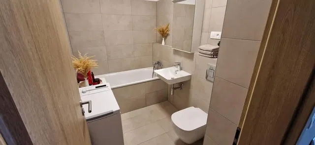 Bathroom; tile floor, renovated, natural light, modern style