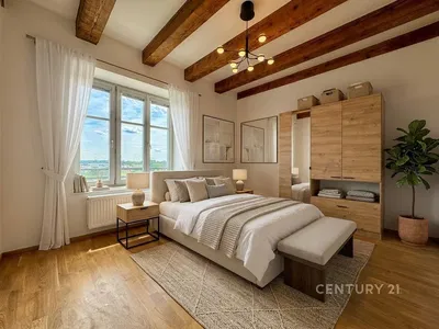 Chambre; lumière naturelle, poutres en bois, parquet