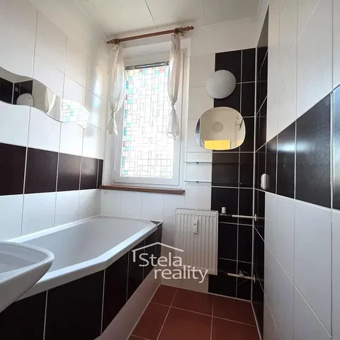 Bathroom; tile floor, tile floor, natural light, renovated