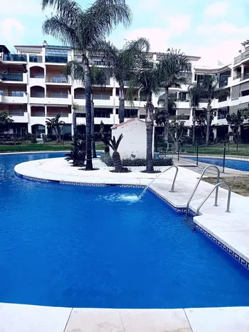 House and surroundings; view