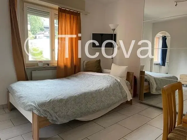 Bedroom; natural light, tile floor