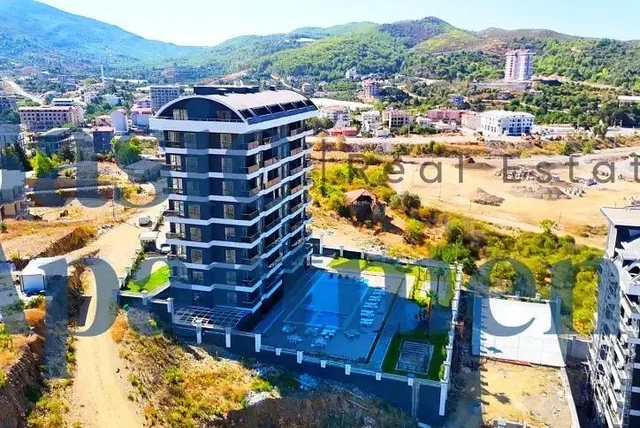 House and surroundings; view