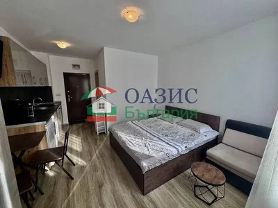 Bedroom; kitchen appliances, wood floor, natural light