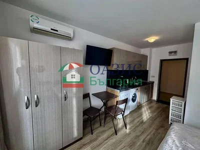 Kitchen; kitchen appliances, wood floor, natural light