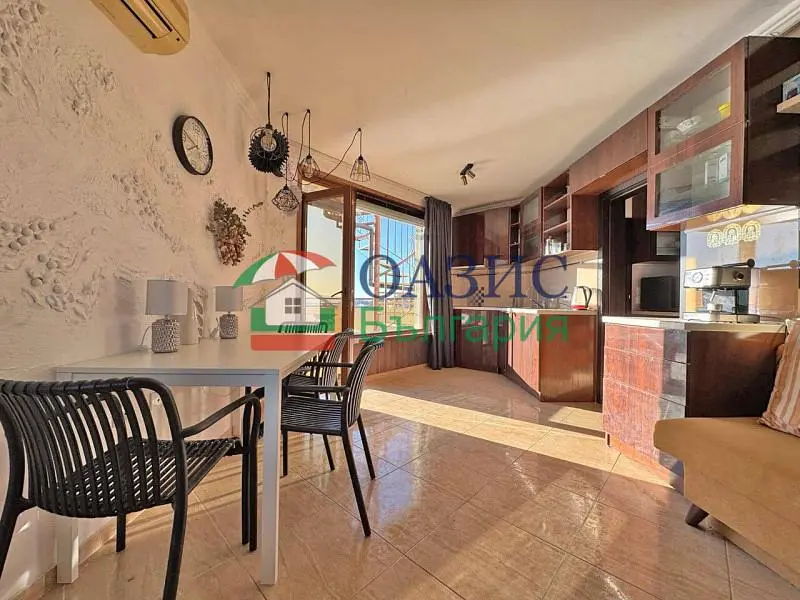 Kitchen; kitchen appliances, tile floor, natural light