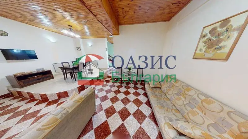 Living room; wood beams, wood floor, tile floor, natural light