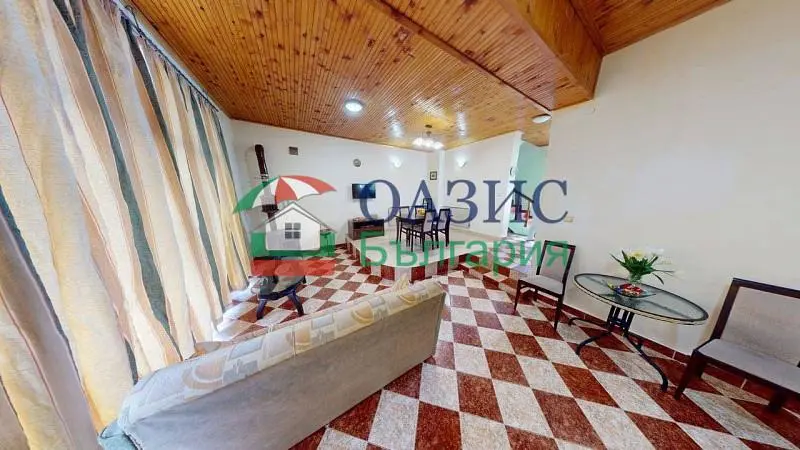 Living room; natural light, wood beams, tile floor