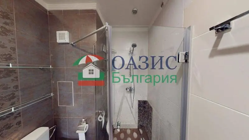 Toilet; tile floor, natural light