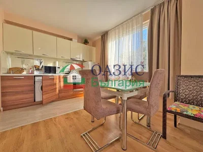 Kitchen; kitchen appliances, wood floor, natural light