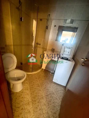 Toilet; tile floor, needs renovation