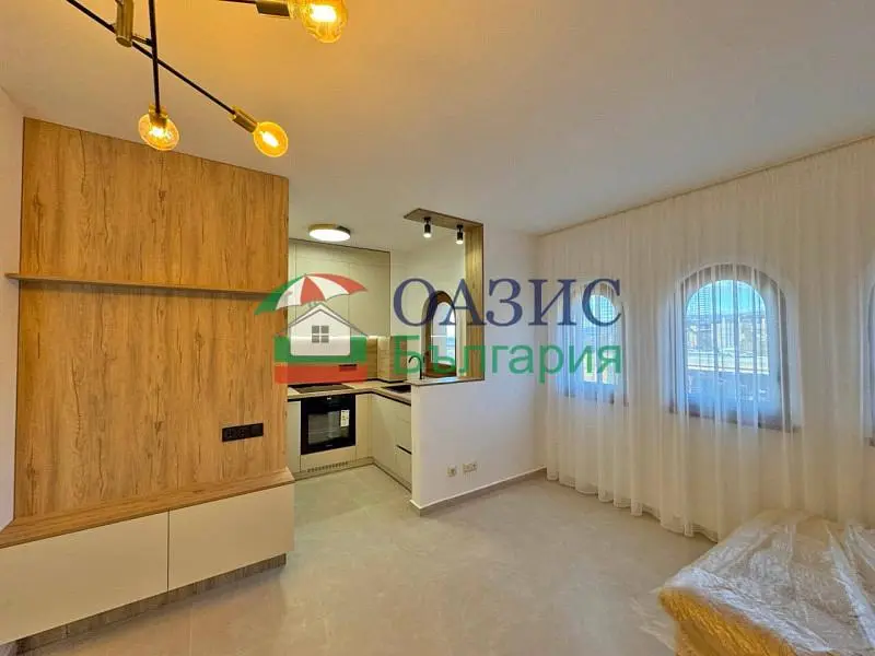 Kitchen; kitchen appliances, tile floor, natural light