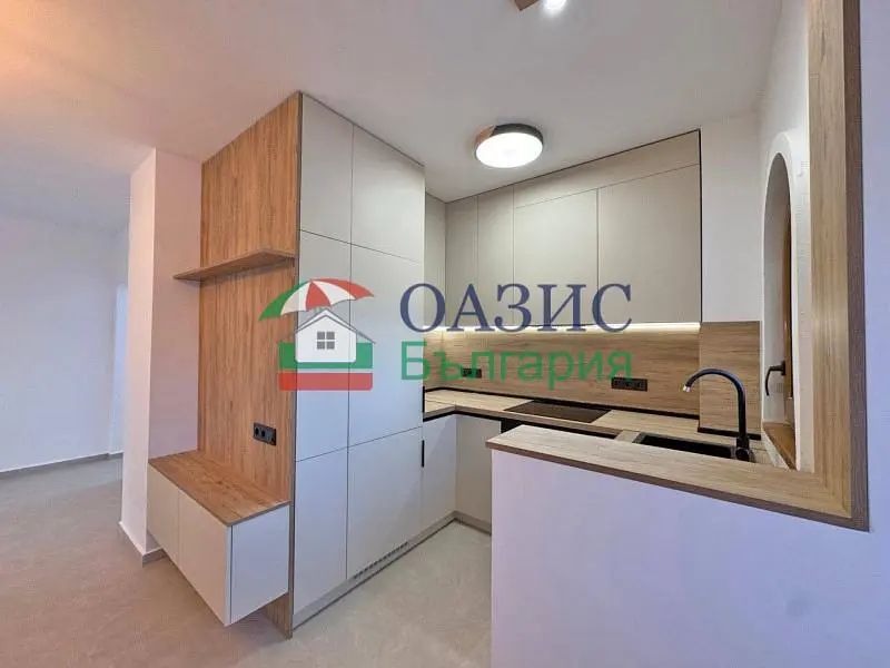 Kitchen; kitchen appliances, tile floor, natural light, renovated