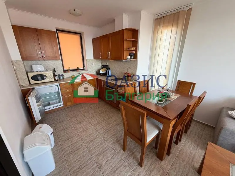Kitchen; kitchen appliances, tile floor, natural light