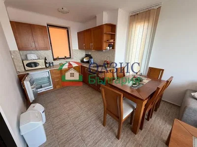 Kitchen; kitchen appliances, tile floor, natural light
