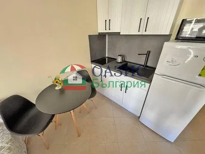 Kitchen; kitchen appliances, tile floor, natural light